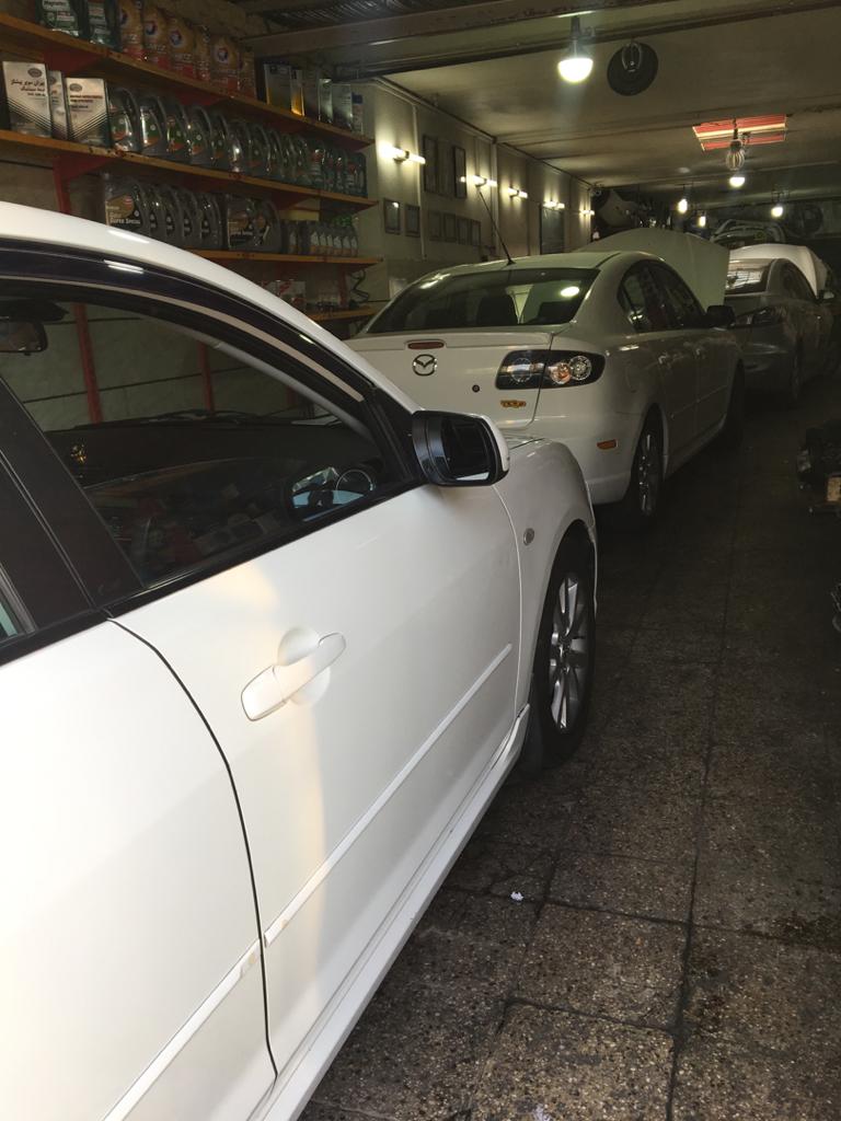 تعمیرگاه مزدا تاپ سرویس.jpeg