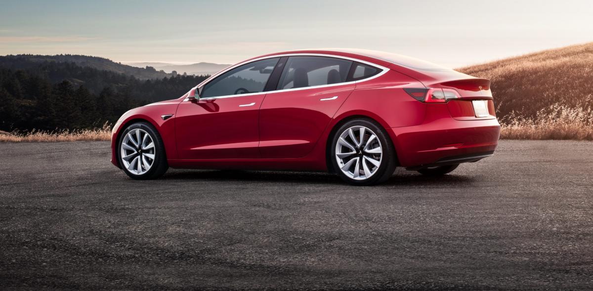 red-tesla-model-3-sunset-e1549437553845.jpg